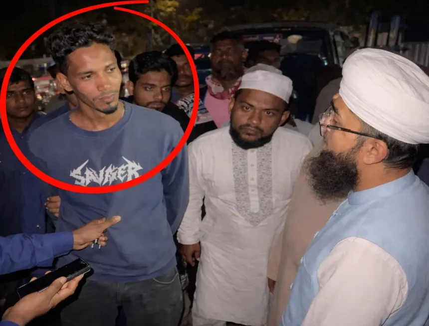 চাঁদাবাজি অভিযানের পর আটক ব্যক্তিকে জিজ্ঞাসাবাদ করছেন স্থানীয় প্রতিনিধি ও পুলিশ সদস্যরা